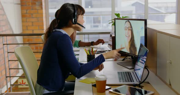 Businesswoman making video call on computer in a modern office 4k