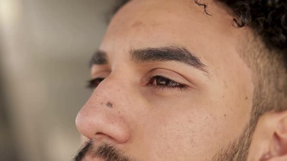 Handsome Young Middle Eastern Man Looking Aside. alt