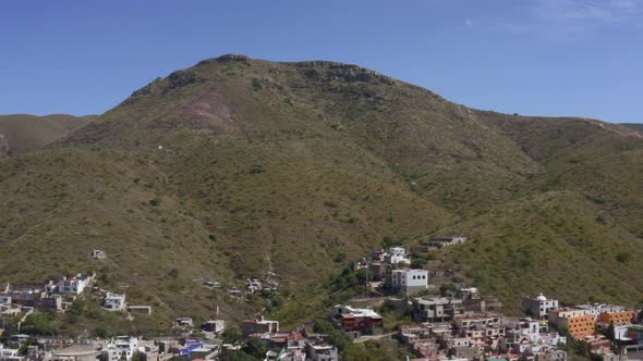 AERIAL: Guanajuato City and Mountains, Mexico (Flying Left) alt