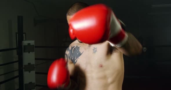 Boxer Punching In Boxing Ring 21