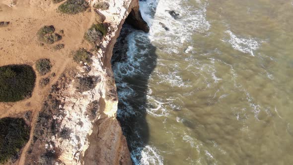 Atlantic Ocean waves on rocky coast,  Benagil Cave,  Lagoa, Algarve, Portugal alt