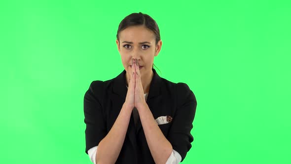 Woman Looking at Camera with Anticipation, Then Very Upset. Green Screen alt