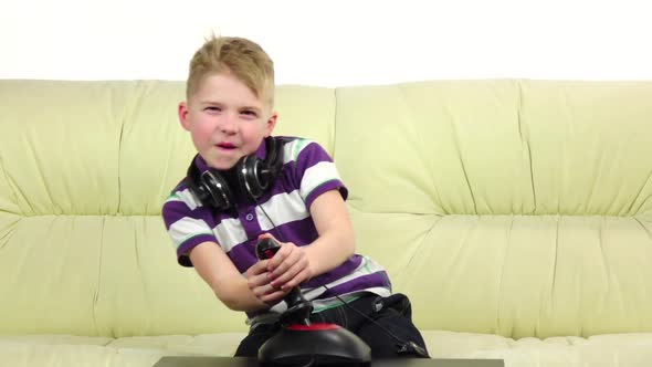 Teen Plays with Joystick in Online Game Sitting. Slow Motion alt