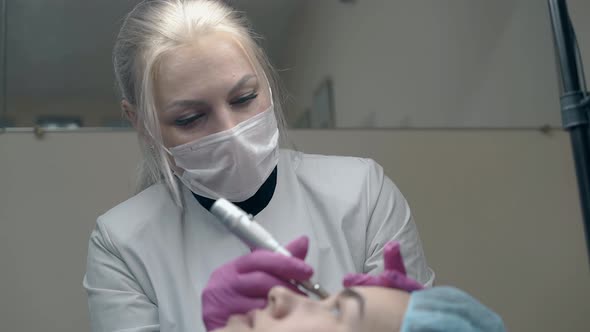 Cosmetology Specialist Fixes White Mask in Beauty Salon alt