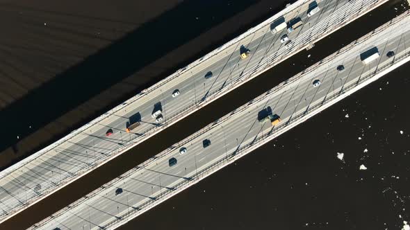 Cars Driving on a Modern Cable-stayed Bridge, Aerial View Vertically Down. alt