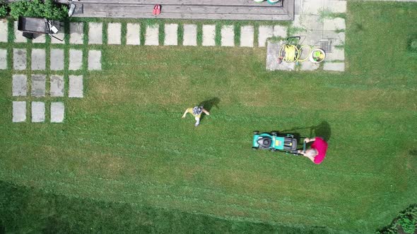 Video Footage of a Man Mowing the Lawn