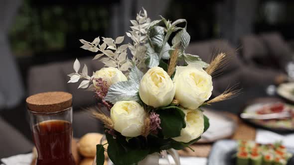decor from a bouquet of flowers on a table in a restaurant