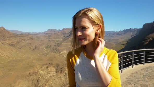Blonde Model Smiling as She Stares into the Stunning View of Gran Canaria