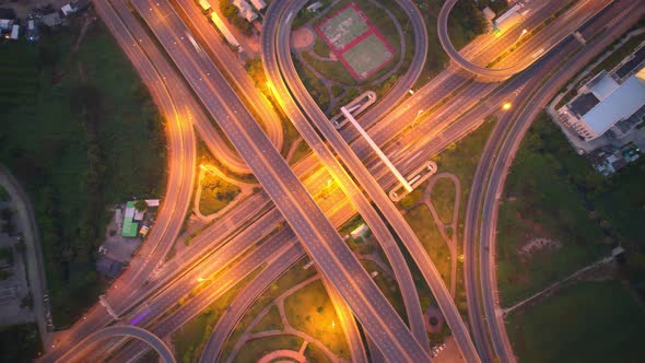 4K : Time lapse Aerial view and top view of traffic on city. Expressway with car lots alt