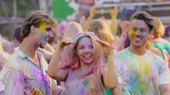 Funny Excited Youngsters Actively Dancing at Color Festival, Extra-Slow Motion alt