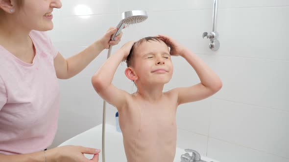 Little Boy with Mother Taking Bath and Washing Under Shower, Stock Footage 