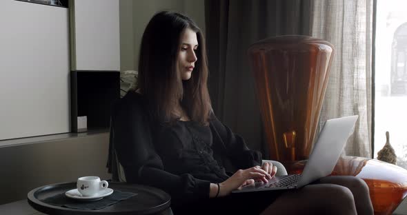 Young Adult Business Woman Typing on Laptop Computer Working in Internet alt