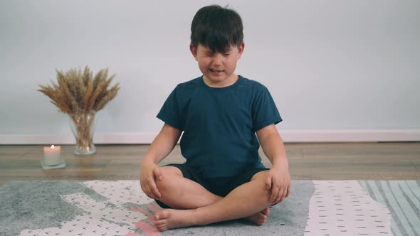 Caucasian Boy Does Yoga Online Child Does Shoulder Warmup Yoga for Beginners Boy Does Exercise