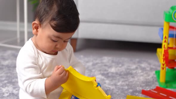 Baby exploring while playing. alt