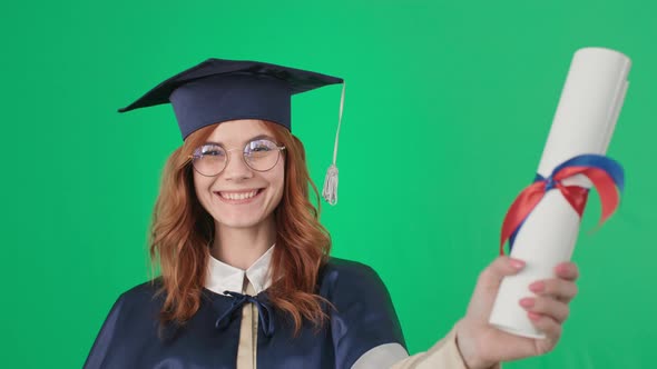 Young Woman with Glasses for Vision is Having Fun and Rejoices at Graduation Holding Diploma in alt