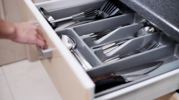 Beautiful chrome cutlery set in a drawer