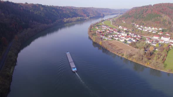 Cargo Pusher Boat on a River Transporting Cargo and Goods Along a Autumnal River alt