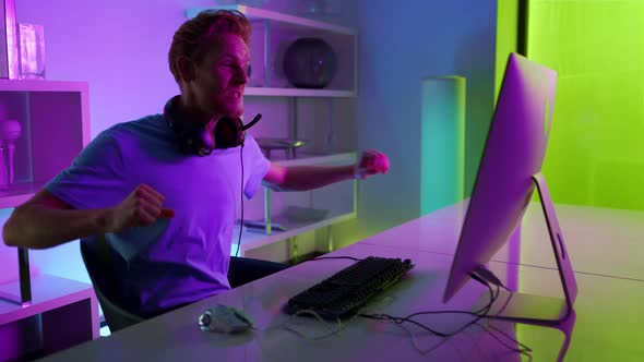 Cyber Game Winner Enjoying Success in Neon Room alt