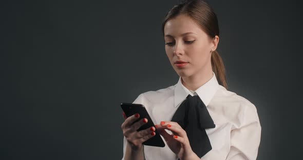 Dissatisfied European Woman Swipes the Screen of Smartphone in a Rush User Declines Messages and alt
