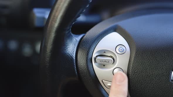 Using the Bluetooth Buttons Located on the Steering Wheel of Car to Talk Over the Phone Hands-Free alt