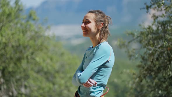 Side View Portrait of Happy Joyful Young Sporty Woman Rock Climber on Natural Summer Background alt