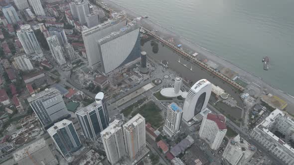 Aerial shot of Dinamo Batumi Stadium near Heroes Square against cityscape alt