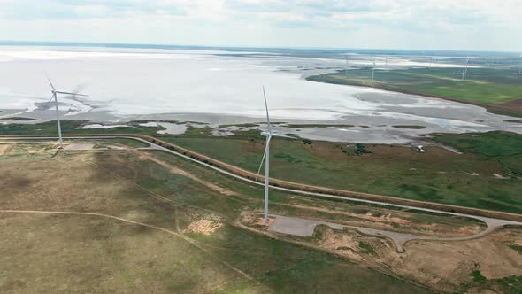 Circle Drone Movement Around Wind Turbine. alt