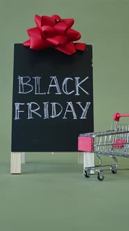 Black Friday Video Footage - Video Of Person Putting Money On A Tiny Push Cart alt