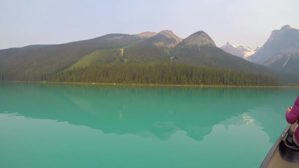 Man travelling on boat in lake 4k alt