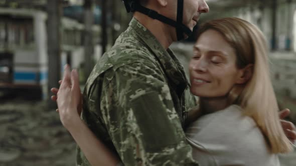 Close Up of Couple Reunion in Abandoned Manufactory alt