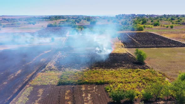 Bird's-eye View From Drone Of Burning Agricultural Field Smoke