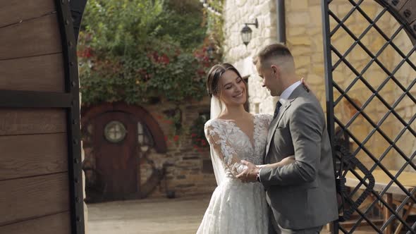 Lovely Newlyweds Caucasian Bride Embracing Groom in Park Making Kiss Wedding Couple Family Hugging alt