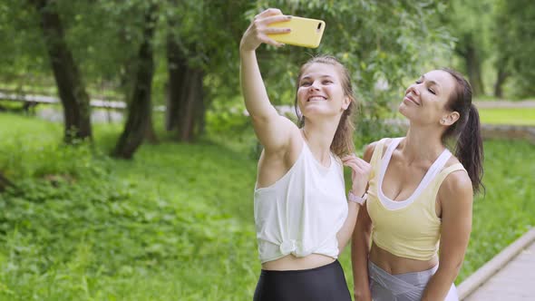 Sportswomen Make Selfie on Empty Wooden Track in Garden