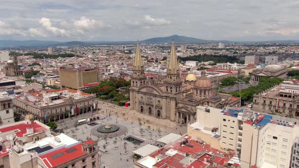 Aerial View Of Guadalajara Cathedral And Plaza Guadalajara In Jalisco, Mexico. - orbit left alt