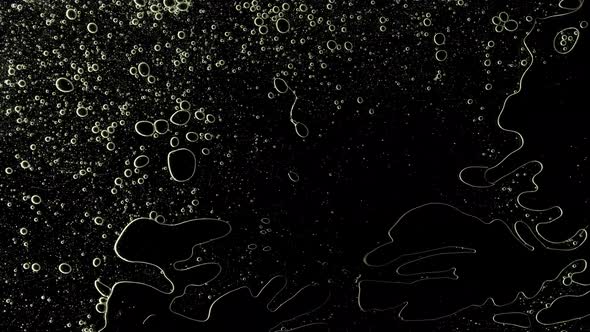 Transparent Cosmetic Gel Fluid with Molecule Bubbles Oil on Black Background alt