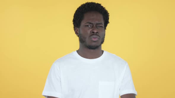 Disliking African Man Rejecting Offer Yellow Background alt