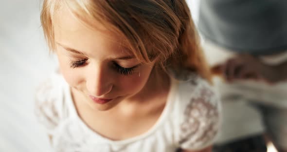 Mother Combing Girl Hair