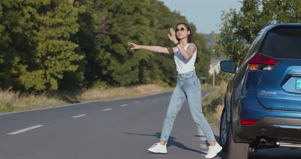 Woman Driver Catching Help for Her Broken Car, Accident at Empty Country Road alt