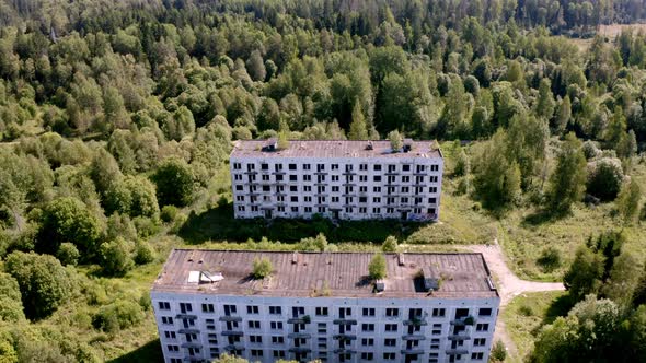 Aerial View of Abandoned and Destroyed Buildings From the Times of the USSR in a Green Picturesque alt