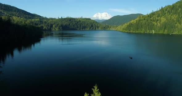 Stunning Lake View Idyllic Relaxing Sunny Day Flying Drone Aerial Towards Boat Mount Rainier alt