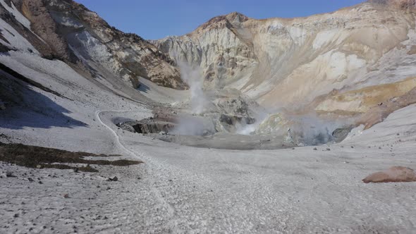 Aerial Drone Footage of Mutnovsky Volcano Crater with Fumaroles and Glacier