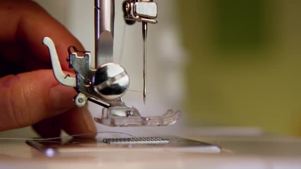 Threading The Needle In A Sewing Machine 32