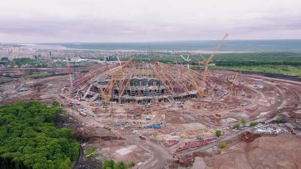 Large Modern Stadium Under Construction in Background Panorama of Modern City in Summer Day