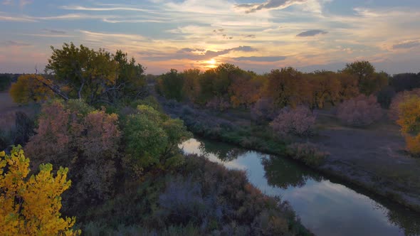 Colors stack in autumn layers in this stunning sunset along the Platte river of Colorado, alt