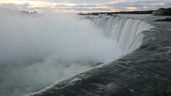 The Falling Water of Niagara Falls in the Early Morning Pulls Into the Depth