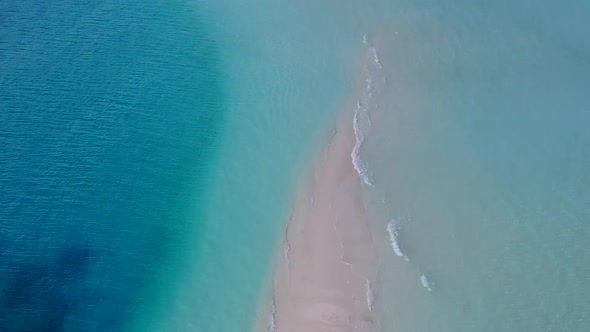 Aerial drone panorama of island beach break by blue sea and sand background alt