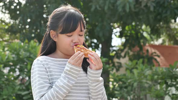 Beautiful Asian Girl Eating Eating Pizza Outdoor alt