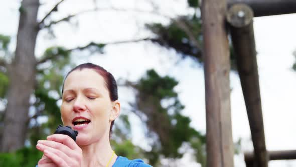 Female trainer clapping hands and whistling alt