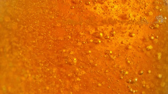 Super Slow Motion Detail Shot of Beer Bubbles in Glass at 1000Fps alt