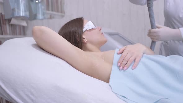 Pretty Woman Getting Laser Hair Removal Procedure